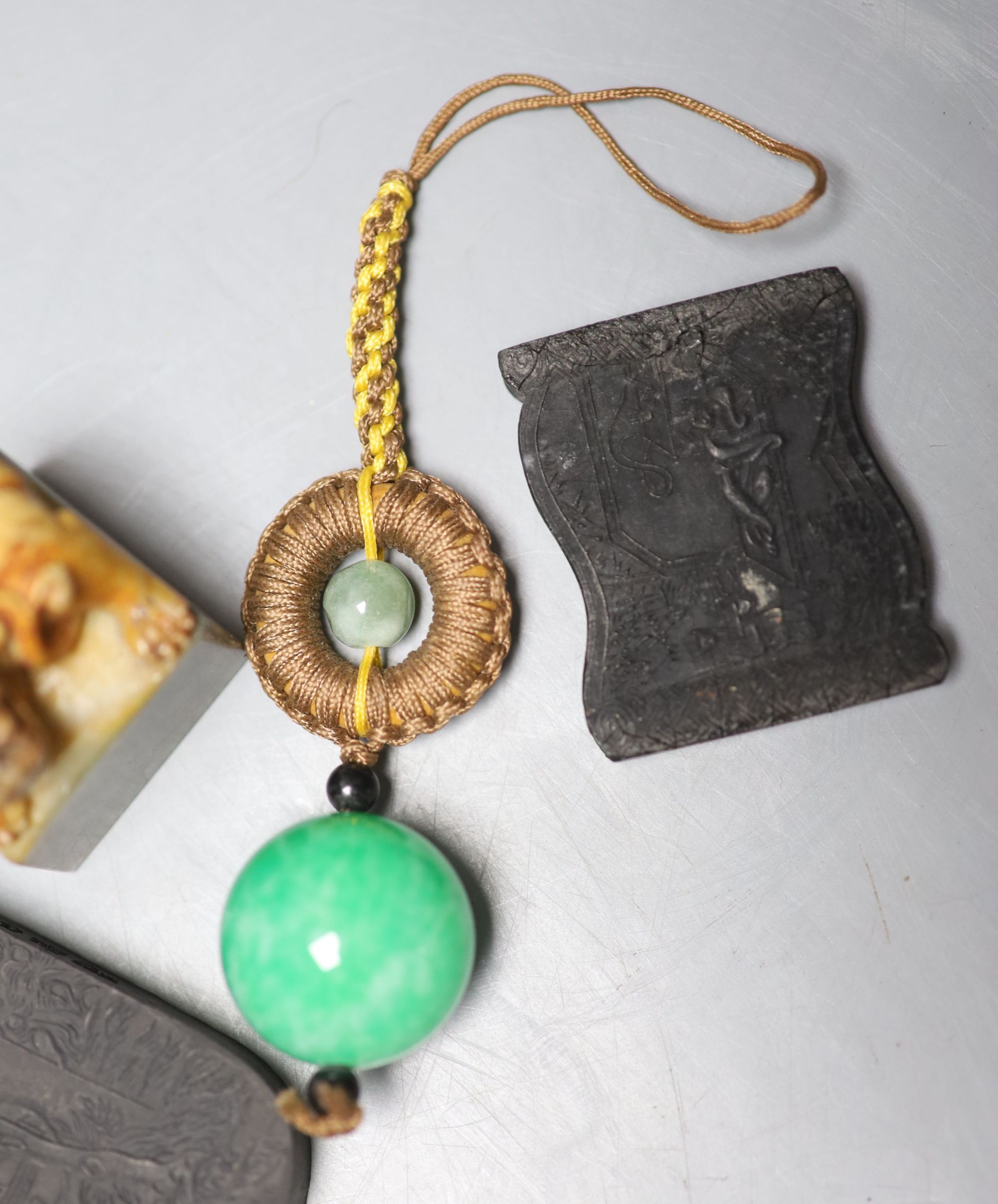 Assorted Chinese small items including two Chinese inkstones, a similar hardstone seal and pendant